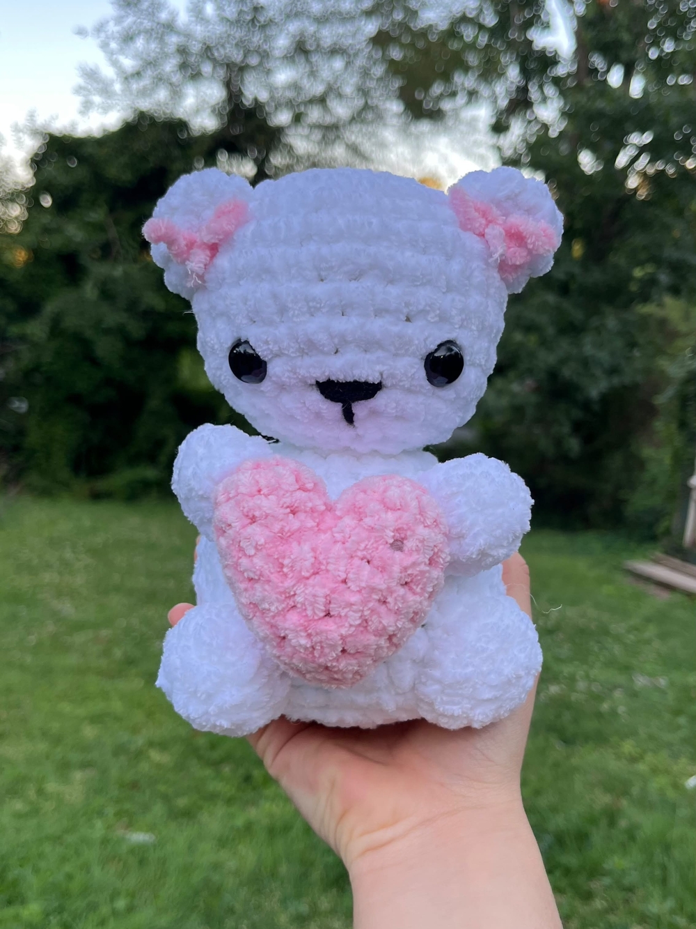 crochet handmade white bear plushie holding pink heart